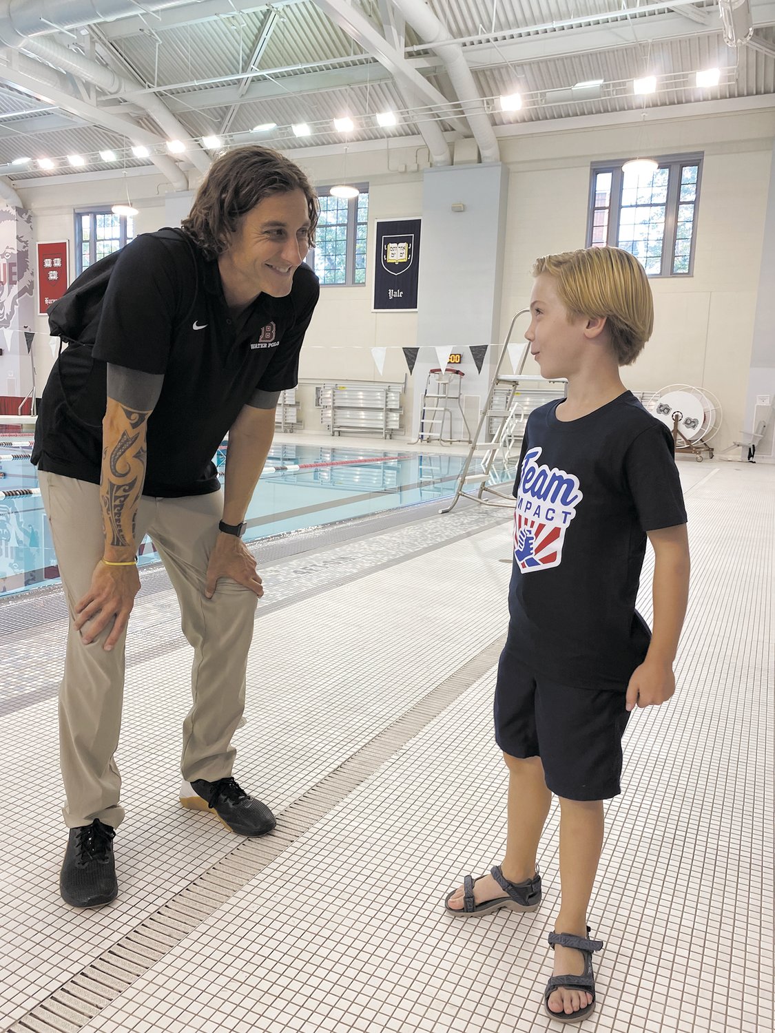 AT THE POOL: Assistant Coach JJ Addison and Shea Mathewson at Brown University’s pool.